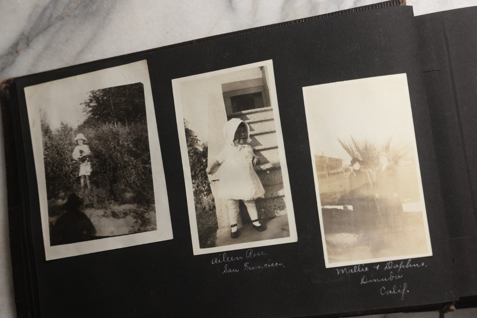 Lot 025 - Antique Snapshot Photo Album Gifted To Zella On Christmas 1916 With 1750+ Photos Of Midwest And Western Scenes Including Telluride & Greeley Colorado, Farm Life, Animals, Automobiles, Oil Wells, Early Aviation, And WWI Soldiers, 1916–1920