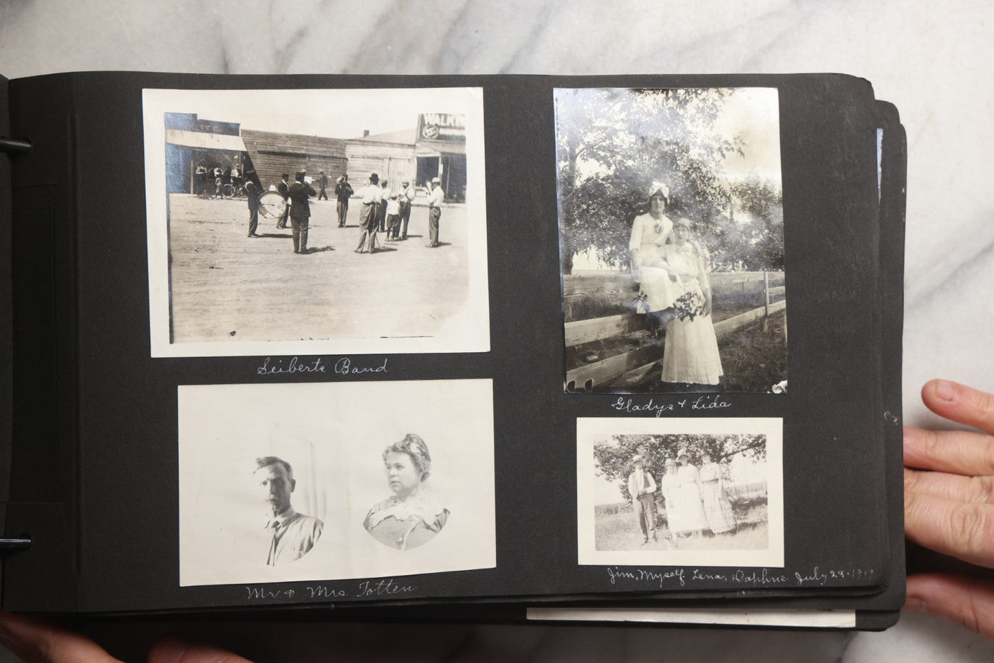 Lot 025 - Antique Snapshot Photo Album Gifted To Zella On Christmas 1916 With 1750+ Photos Of Midwest And Western Scenes Including Telluride & Greeley Colorado, Farm Life, Animals, Automobiles, Oil Wells, Early Aviation, And WWI Soldiers, 1916–1920