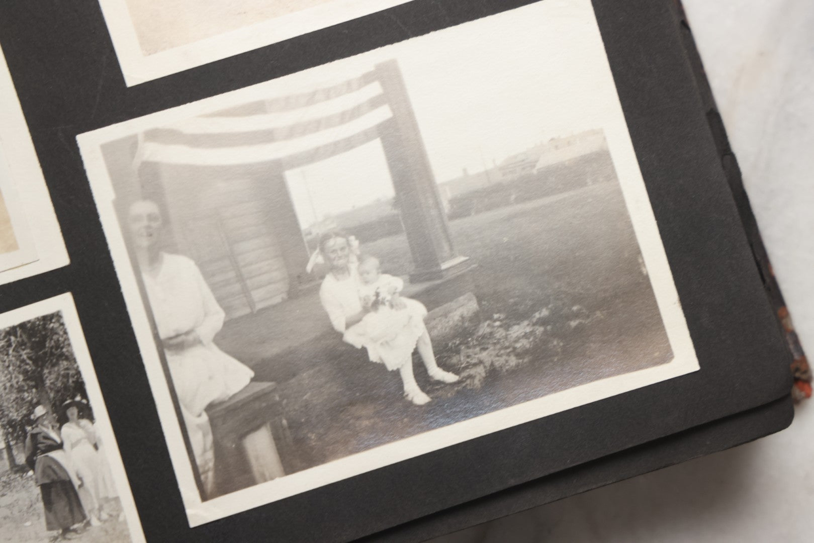 Lot 025 - Antique Snapshot Photo Album Gifted To Zella On Christmas 1916 With 1750+ Photos Of Midwest And Western Scenes Including Telluride & Greeley Colorado, Farm Life, Animals, Automobiles, Oil Wells, Early Aviation, And WWI Soldiers, 1916–1920