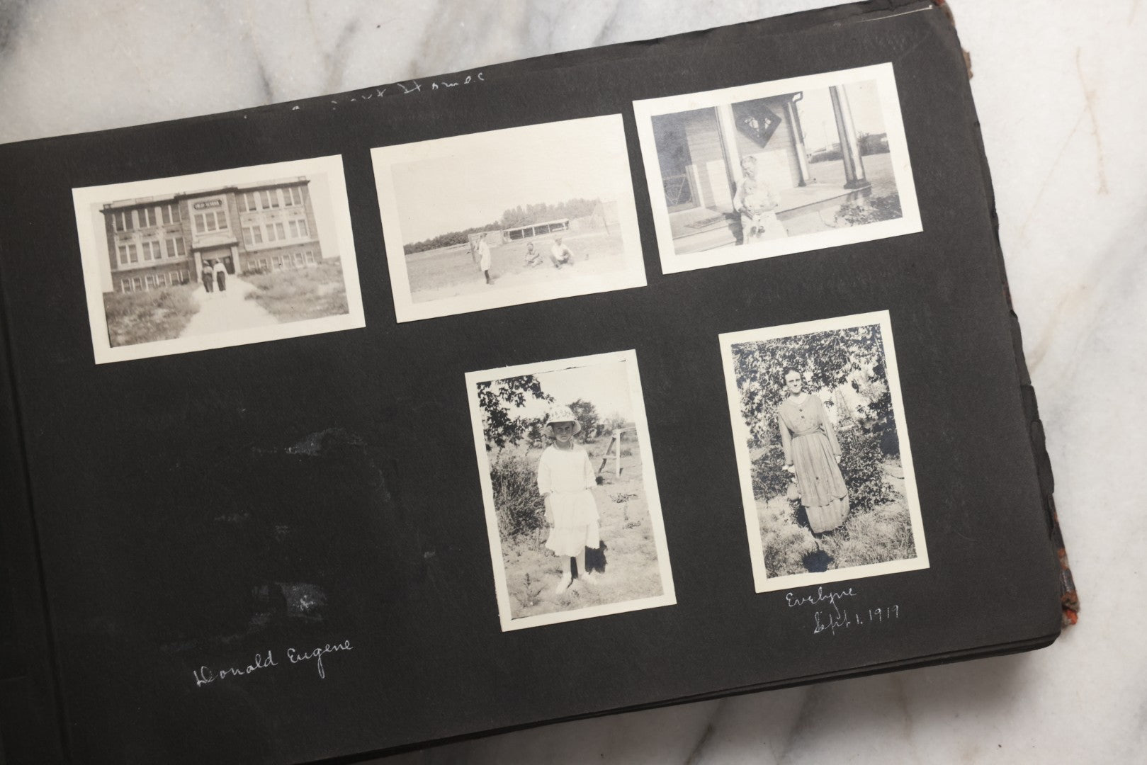 Lot 025 - Antique Snapshot Photo Album Gifted To Zella On Christmas 1916 With 1750+ Photos Of Midwest And Western Scenes Including Telluride & Greeley Colorado, Farm Life, Animals, Automobiles, Oil Wells, Early Aviation, And WWI Soldiers, 1916–1920
