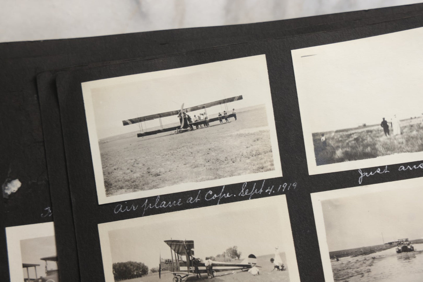 Lot 025 - Antique Snapshot Photo Album Gifted To Zella On Christmas 1916 With 1750+ Photos Of Midwest And Western Scenes Including Telluride & Greeley Colorado, Farm Life, Animals, Automobiles, Oil Wells, Early Aviation, And WWI Soldiers, 1916–1920