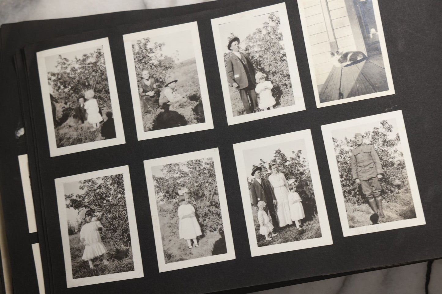 Lot 025 - Antique Snapshot Photo Album Gifted To Zella On Christmas 1916 With 1750+ Photos Of Midwest And Western Scenes Including Telluride & Greeley Colorado, Farm Life, Animals, Automobiles, Oil Wells, Early Aviation, And WWI Soldiers, 1916–1920