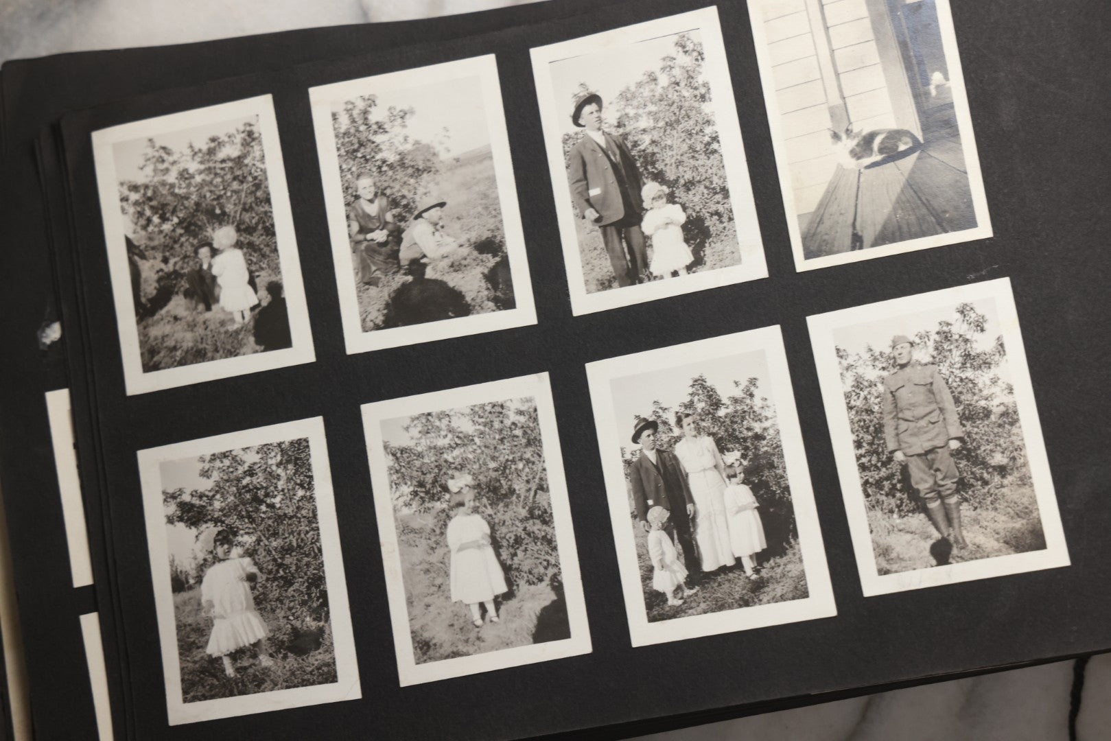 Lot 025 - Antique Snapshot Photo Album Gifted To Zella On Christmas 1916 With 1750+ Photos Of Midwest And Western Scenes Including Telluride & Greeley Colorado, Farm Life, Animals, Automobiles, Oil Wells, Early Aviation, And WWI Soldiers, 1916–1920