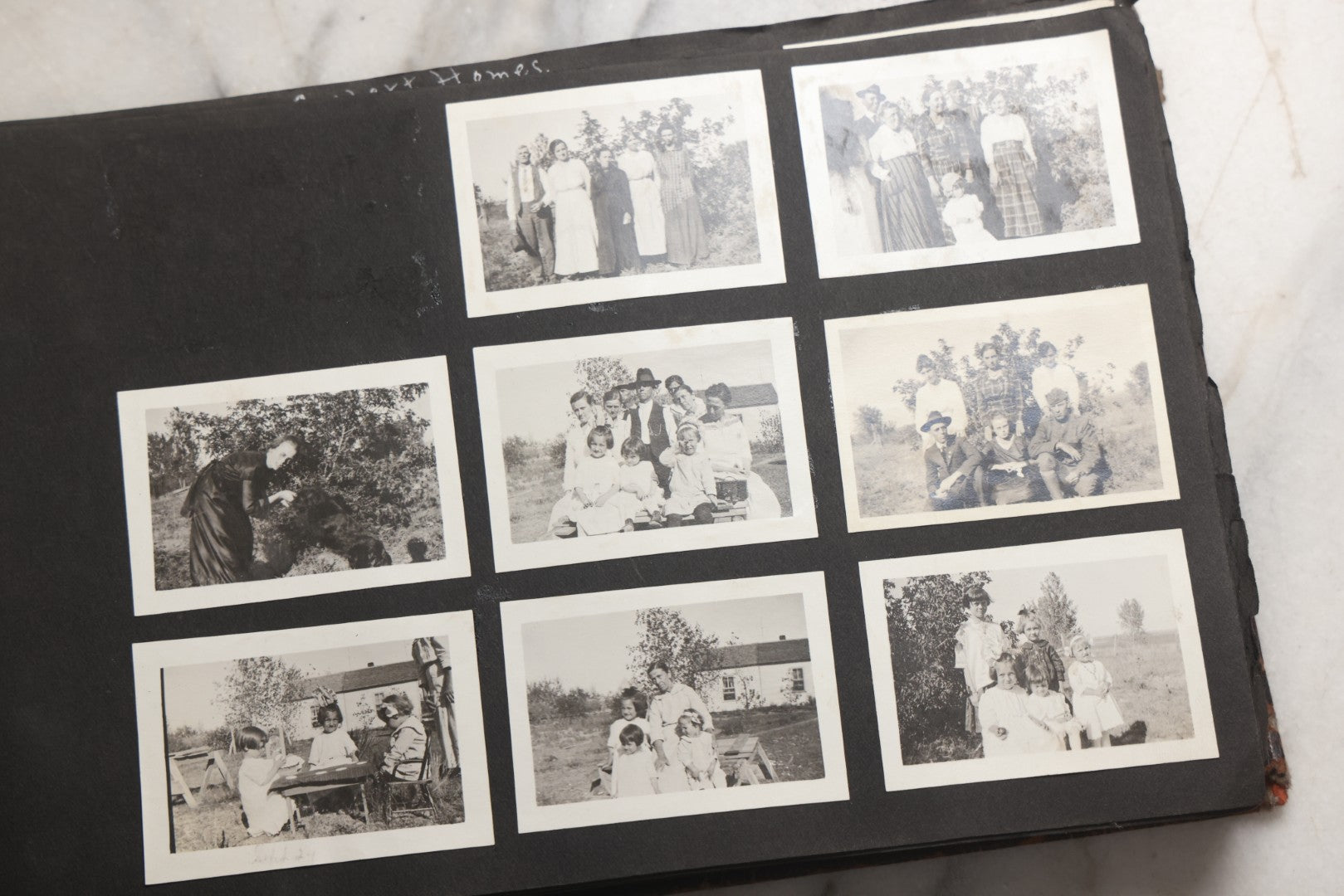 Lot 025 - Antique Snapshot Photo Album Gifted To Zella On Christmas 1916 With 1750+ Photos Of Midwest And Western Scenes Including Telluride & Greeley Colorado, Farm Life, Animals, Automobiles, Oil Wells, Early Aviation, And WWI Soldiers, 1916–1920