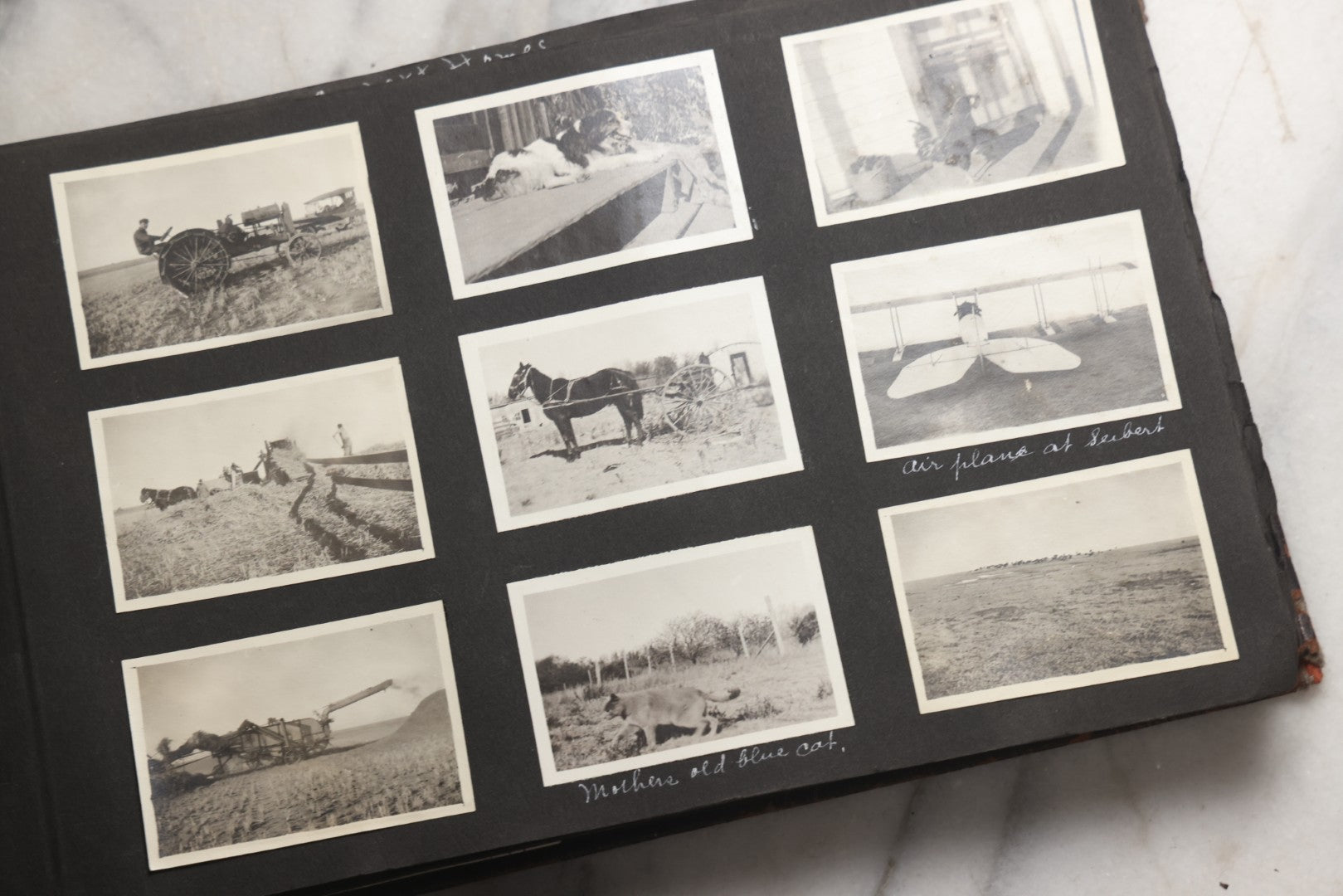 Lot 025 - Antique Snapshot Photo Album Gifted To Zella On Christmas 1916 With 1750+ Photos Of Midwest And Western Scenes Including Telluride & Greeley Colorado, Farm Life, Animals, Automobiles, Oil Wells, Early Aviation, And WWI Soldiers, 1916–1920