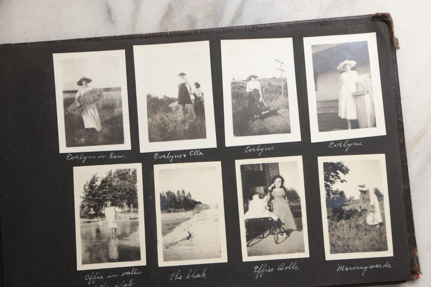 Lot 025 - Antique Snapshot Photo Album Gifted To Zella On Christmas 1916 With 1750+ Photos Of Midwest And Western Scenes Including Telluride & Greeley Colorado, Farm Life, Animals, Automobiles, Oil Wells, Early Aviation, And WWI Soldiers, 1916–1920