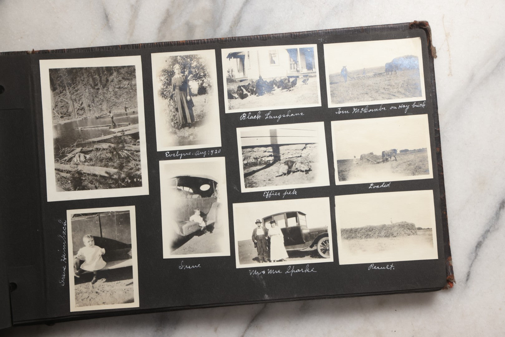 Lot 025 - Antique Snapshot Photo Album Gifted To Zella On Christmas 1916 With 1750+ Photos Of Midwest And Western Scenes Including Telluride & Greeley Colorado, Farm Life, Animals, Automobiles, Oil Wells, Early Aviation, And WWI Soldiers, 1916–1920