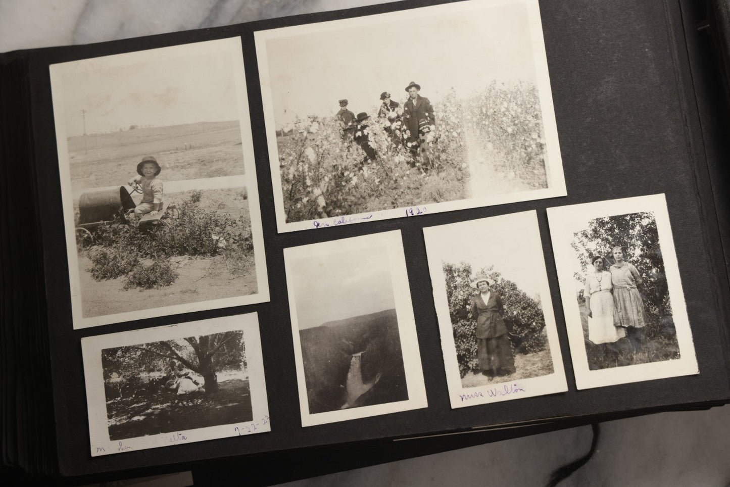 Lot 025 - Antique Snapshot Photo Album Gifted To Zella On Christmas 1916 With 1750+ Photos Of Midwest And Western Scenes Including Telluride & Greeley Colorado, Farm Life, Animals, Automobiles, Oil Wells, Early Aviation, And WWI Soldiers, 1916–1920