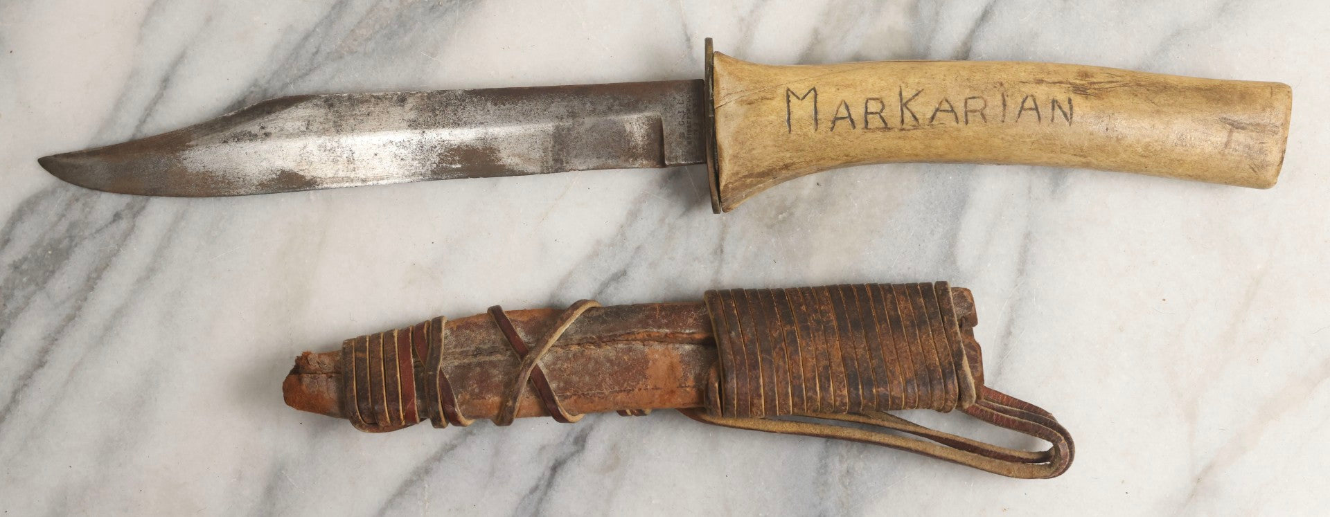 Lot 030 - Antique No. 521 8–12" Bowie Hunting Knife With Stag Antler Handle Carved “Mar Karian,” By Bridgeport Gun And Implement Company (B.G.I. Co.), Bridgeport, Connecticut, With Custom Leather Sheath