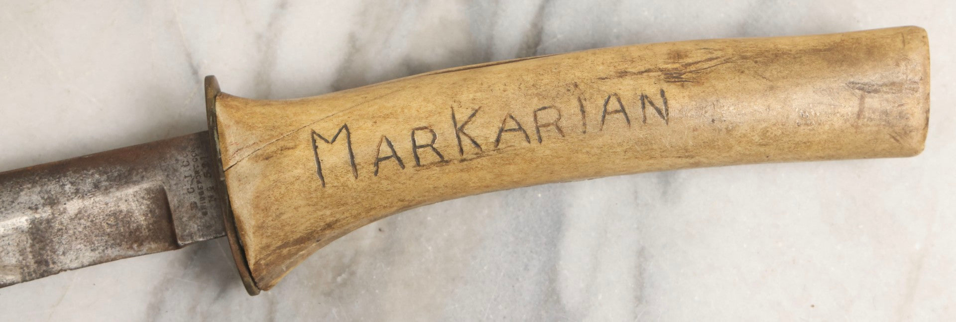 Lot 030 - Antique No. 521 8–12" Bowie Hunting Knife With Stag Antler Handle Carved “Mar Karian,” By Bridgeport Gun And Implement Company (B.G.I. Co.), Bridgeport, Connecticut, With Custom Leather Sheath