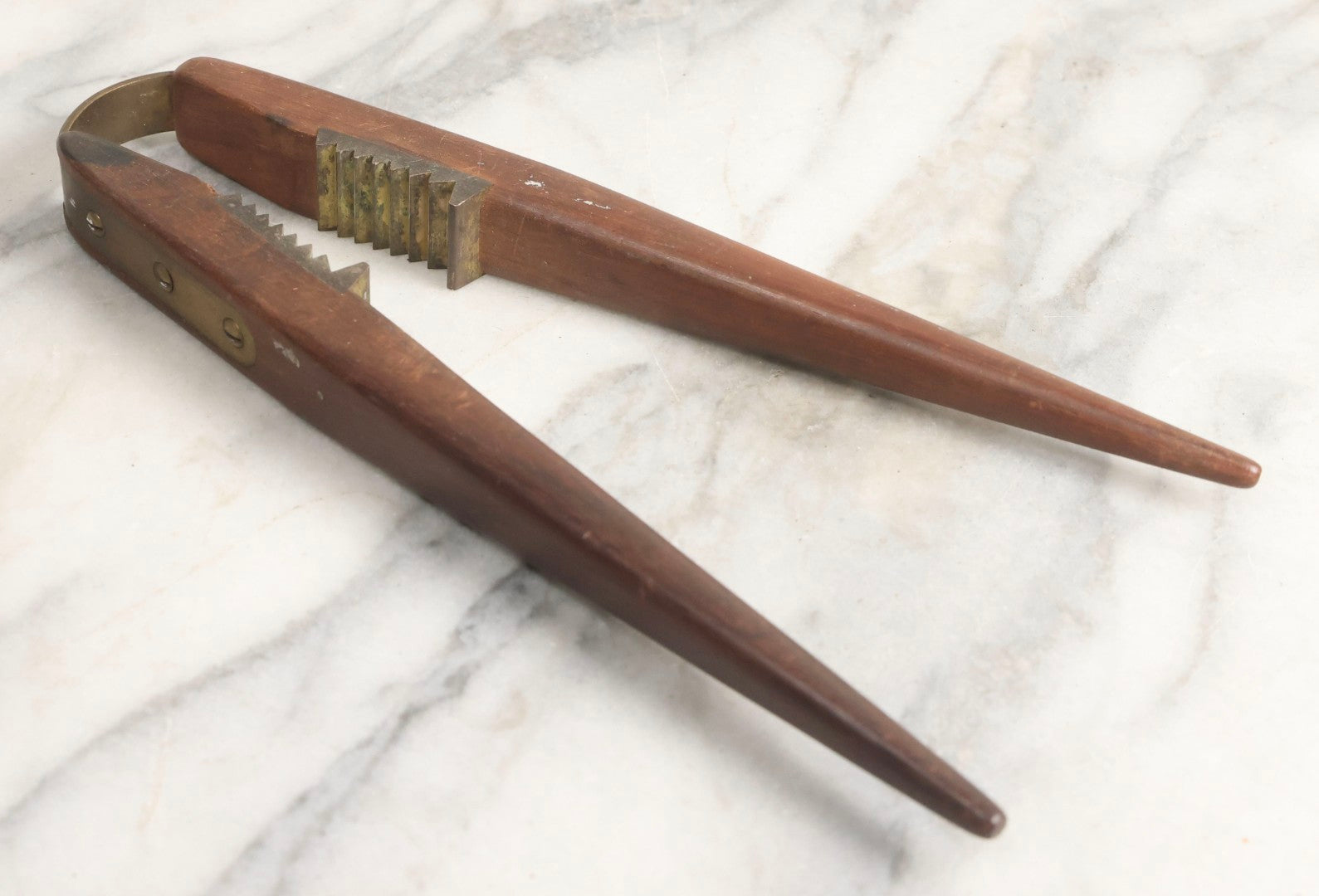 Lot 031 - Antique Wood-Handled Nutcracker With Brass Hardware, Bent Brass Spring Band, And Aggressive Brass Jaws