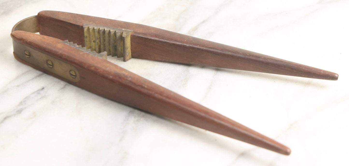 Lot 031 - Antique Wood-Handled Nutcracker With Brass Hardware, Bent Brass Spring Band, And Aggressive Brass Jaws