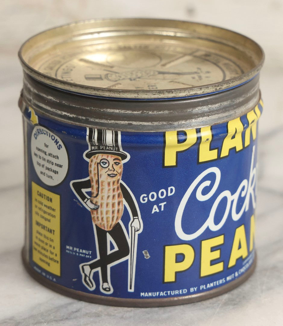 Lot 036 - Trio Of Advertising Tins Including Gescowide Vision Goggles, Laurel Ladies' Boudoir Safety Razor With Contents, And Planters Cocktail Peanuts