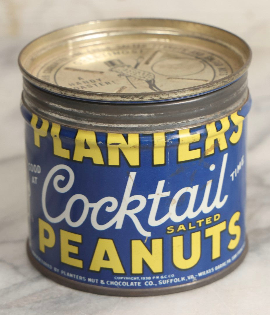 Lot 036 - Trio Of Advertising Tins Including Gescowide Vision Goggles, Laurel Ladies' Boudoir Safety Razor With Contents, And Planters Cocktail Peanuts