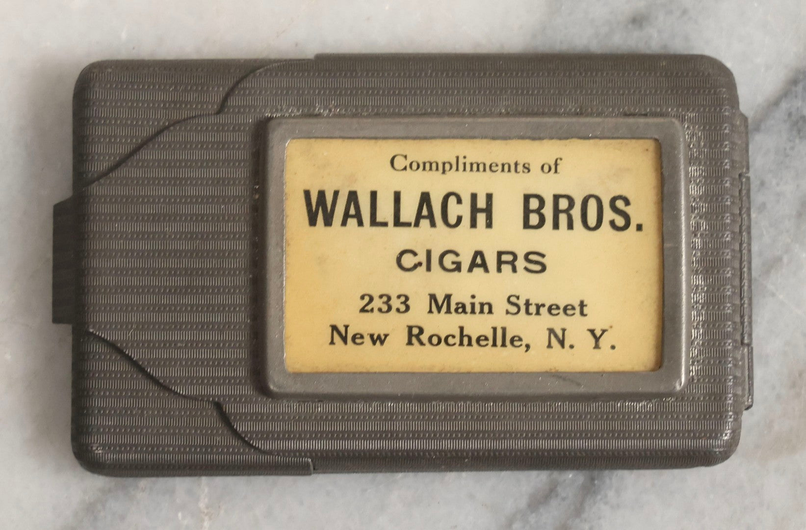 Lot 037 - Antique Pressed Tin Advertising Match Safe, “Compliments Of Wallach Bros. Cigars," 233 Main Street, New Rochelle, New York, Made In Germany