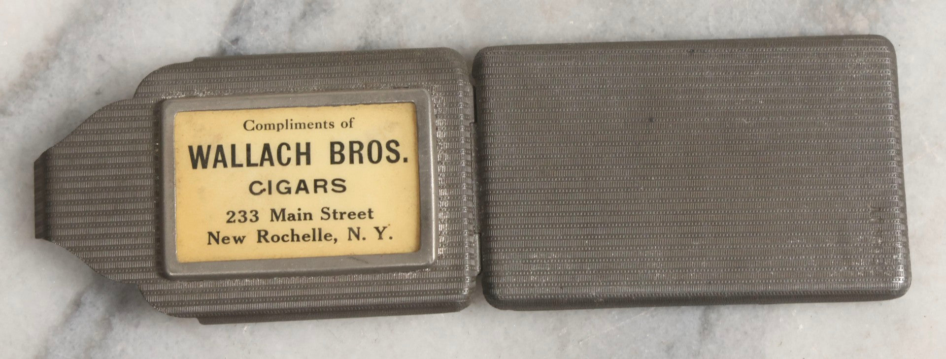 Lot 037 - Antique Pressed Tin Advertising Match Safe, “Compliments Of Wallach Bros. Cigars," 233 Main Street, New Rochelle, New York, Made In Germany
