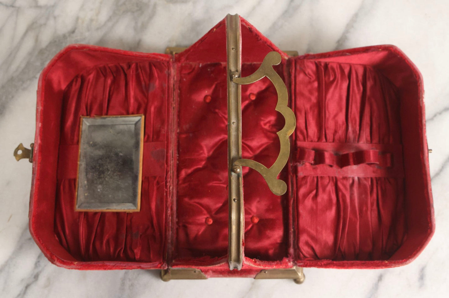 Lot 044 - Antique Rigid Red Velvet Ladies' Purse With Fold-Down Sides, Interior Mirror, Tufted Cushion, And Upholstered Interior