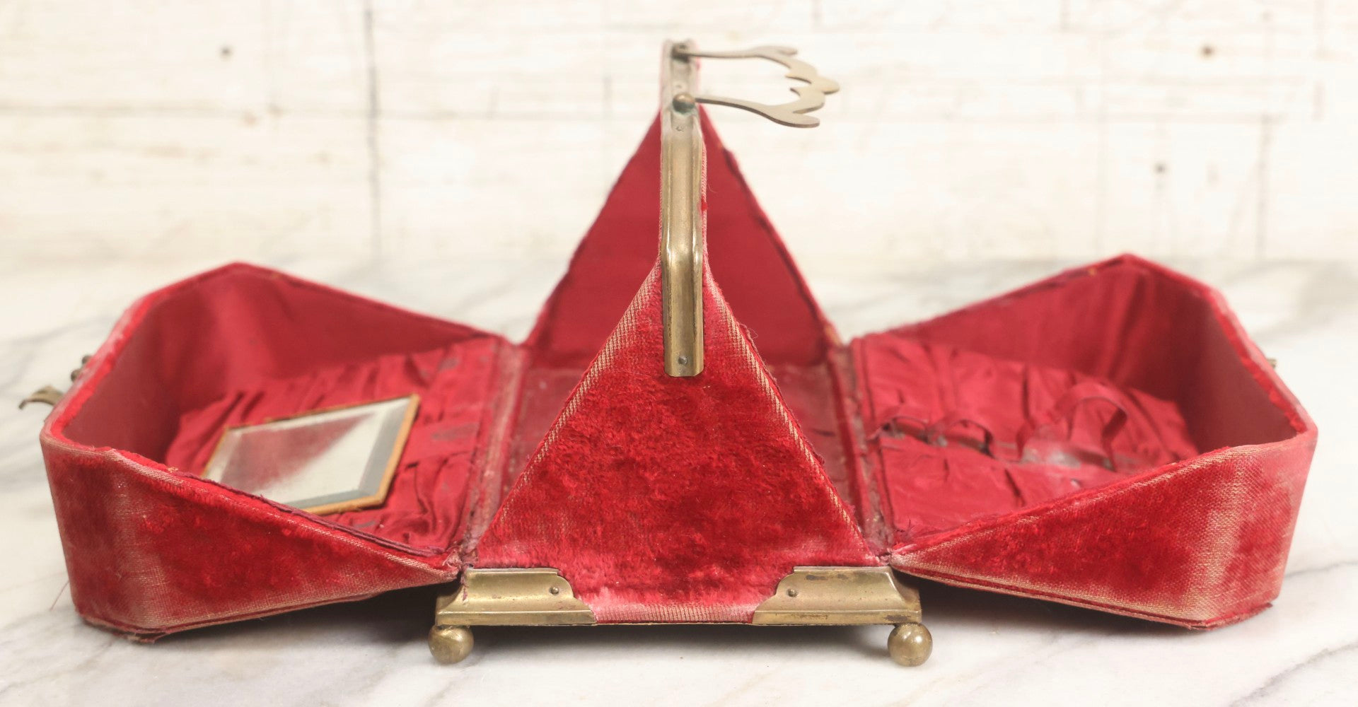Lot 044 - Antique Rigid Red Velvet Ladies' Purse With Fold-Down Sides, Interior Mirror, Tufted Cushion, And Upholstered Interior