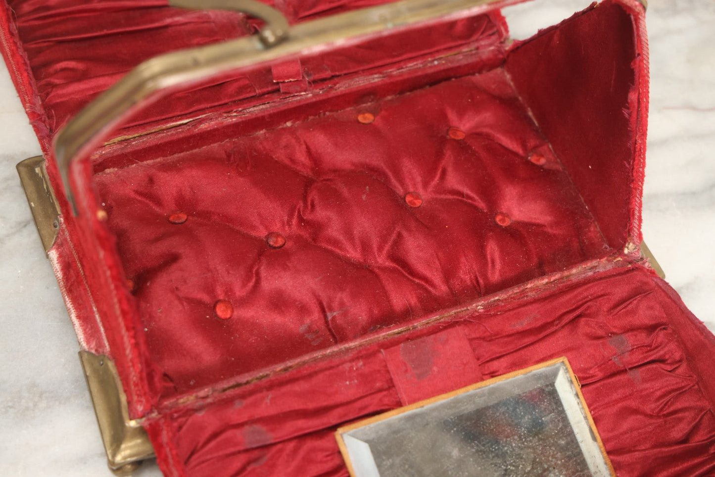 Lot 044 - Antique Rigid Red Velvet Ladies' Purse With Fold-Down Sides, Interior Mirror, Tufted Cushion, And Upholstered Interior