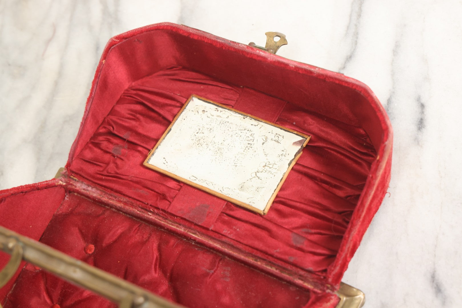 Lot 044 - Antique Rigid Red Velvet Ladies' Purse With Fold-Down Sides, Interior Mirror, Tufted Cushion, And Upholstered Interior