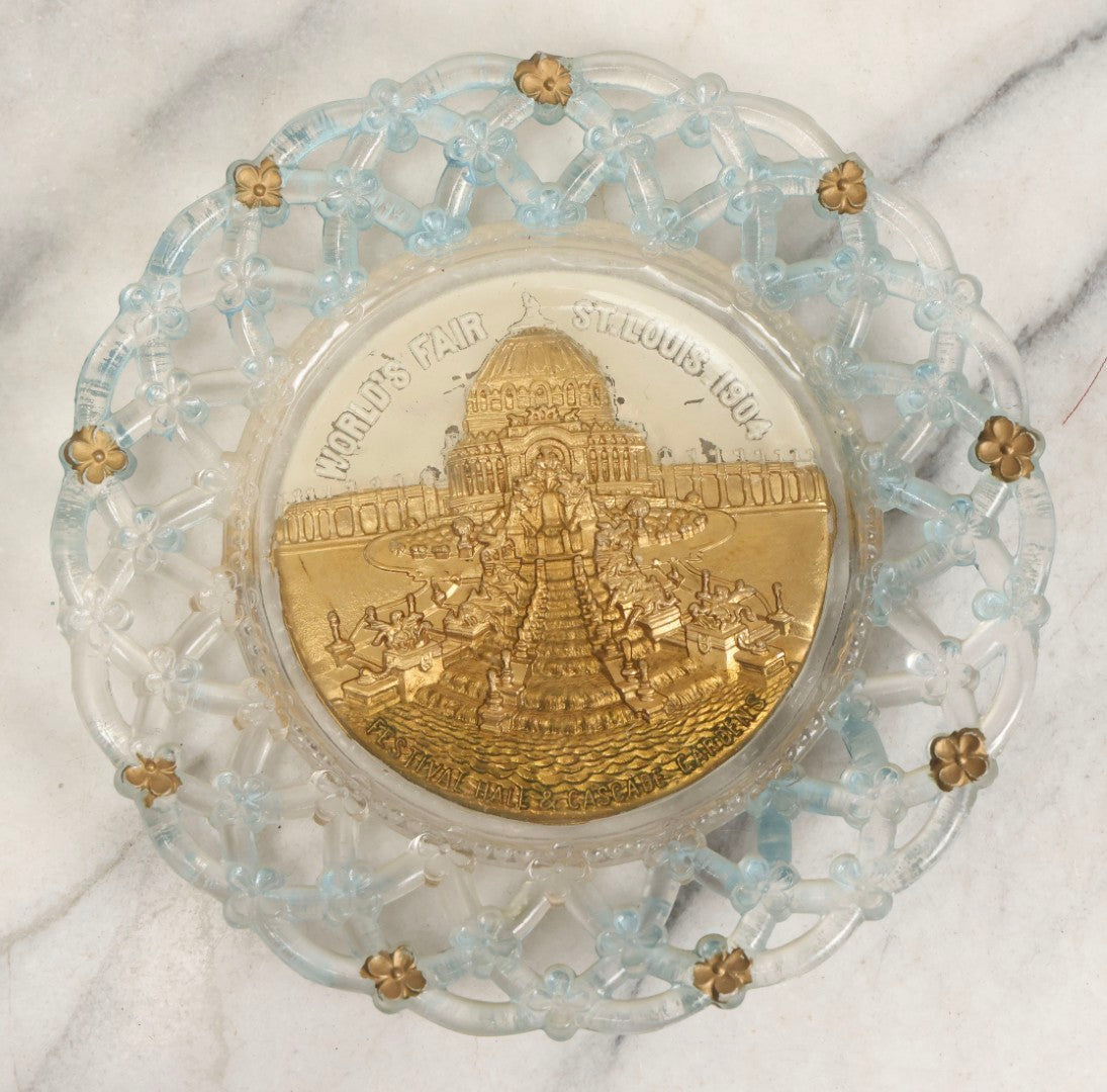 Lot 048 - Antique Goofus Glass Plate With Lattice Edge And Embossed Reverse-Painted Image Of Festival Hall And Cascade Gardens, World's Fair St. Louis 1904, With Gold- And Blue-Painted Accents