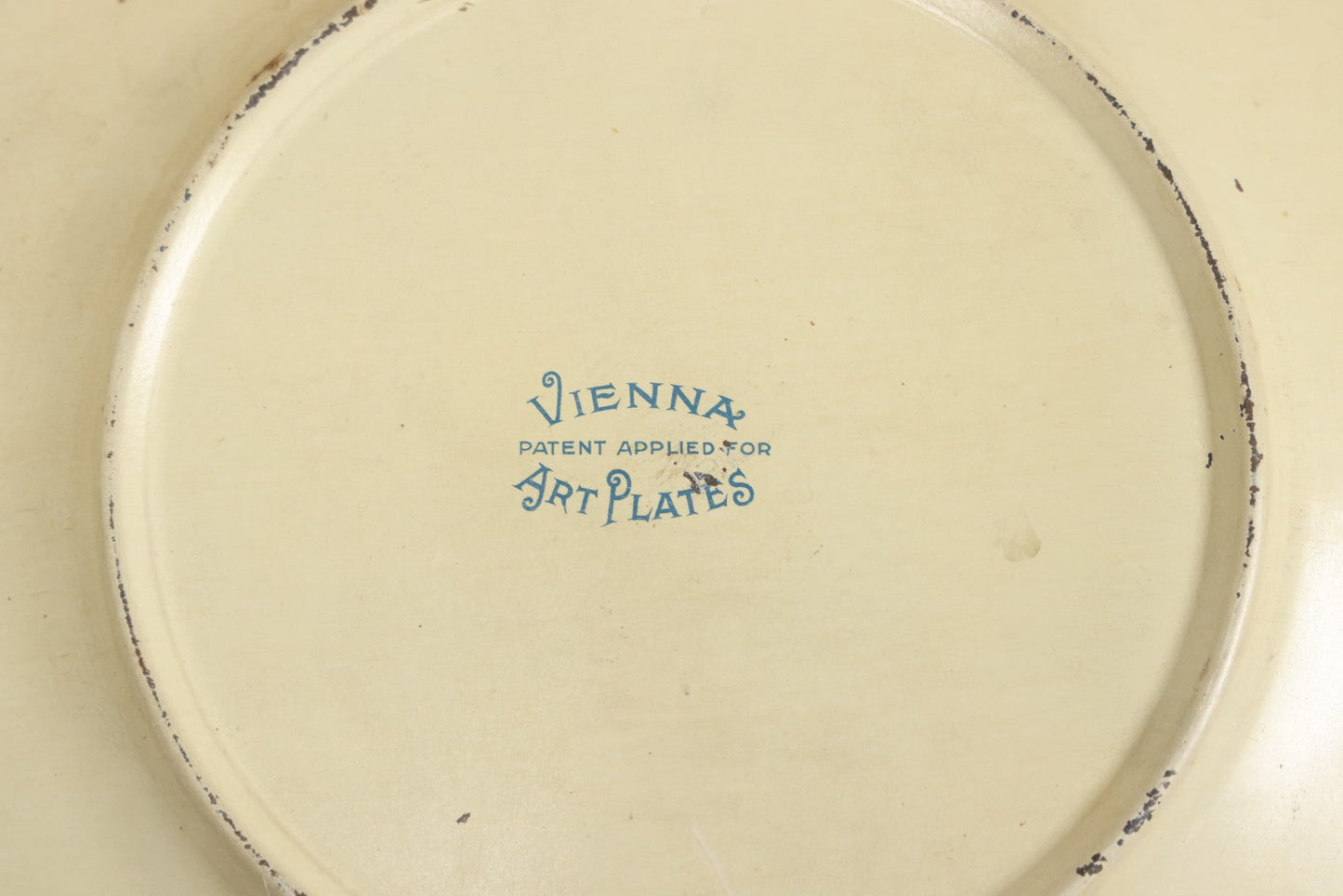 Lot 049 - Antique Vienna Art Plates Tin Lithograph Decorative Plate With Classical Maiden, Birds, And Floral Motifs, Marked “Vienna Art Plates, Patent Applied For”