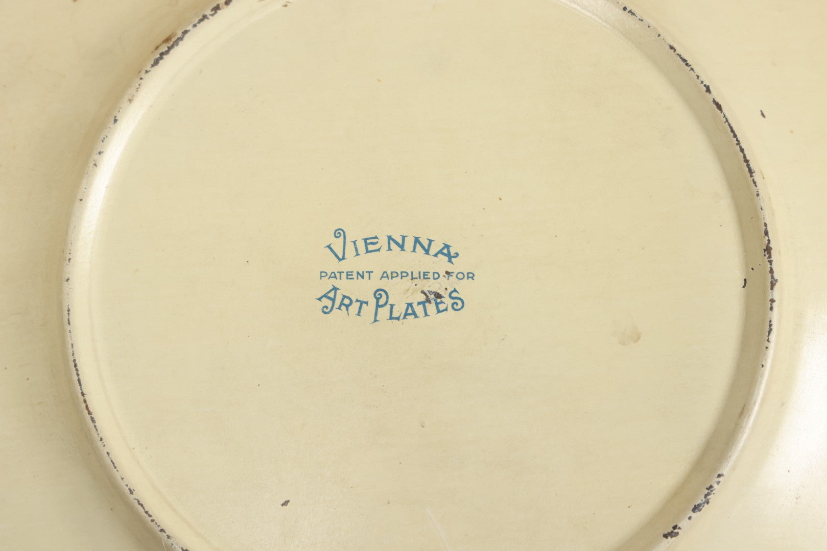 Lot 049 - Antique Vienna Art Plates Tin Lithograph Decorative Plate With Classical Maiden, Birds, And Floral Motifs, Marked “Vienna Art Plates, Patent Applied For”