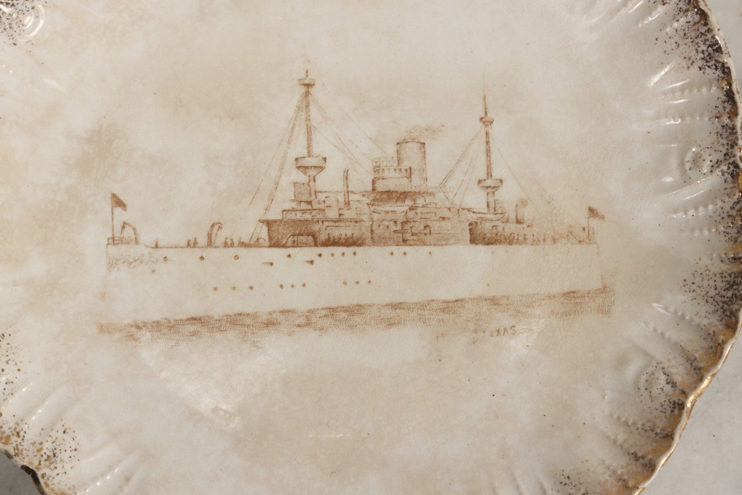 Lot 050 - Antique Transferware Commemorative Plate Of Uss Texas Marked “Semi Porcelain” With Dragon-In-Crown Hallmark And Modern Plate Hanger