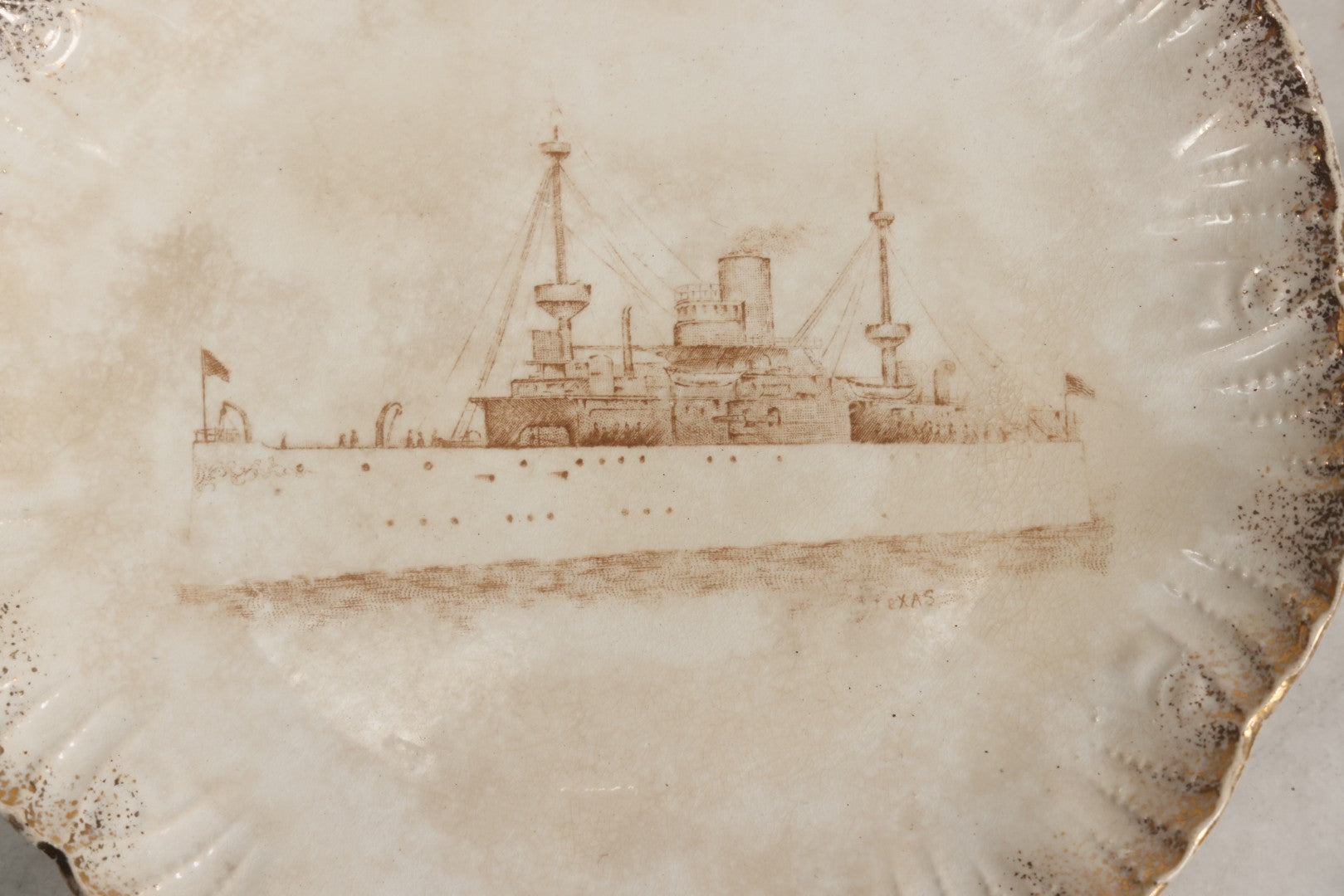 Lot 050 - Antique Transferware Commemorative Plate Of Uss Texas Marked “Semi Porcelain” With Dragon-In-Crown Hallmark And Modern Plate Hanger