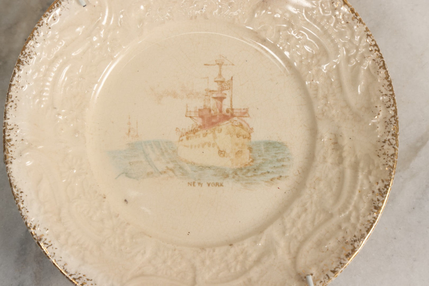 Lot 051 - Antique Transferware Commemorative Plate Of Uss New York (ACR-2) Marked “The Sebring Porcelain” With Modern Plate Hanger