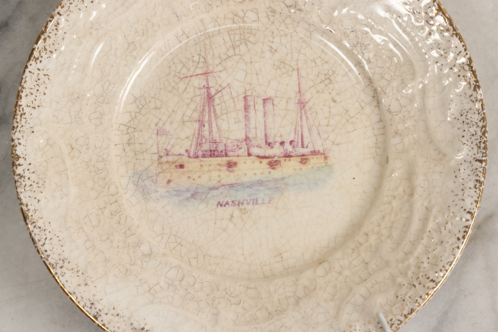 Lot 052 - Antique Transferware Commemorative Plate Of Uss Nashville (PG-7) Marked “The Sebring Porcelain” With Modern Plate Hanger