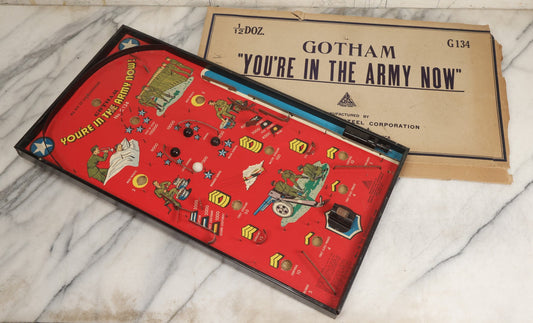 Lot 053 - Vintage World War Two Era “You'Re In The Army Now” Toy Pinball Tabletop Game By Gotham Pressed Steel Corp., 1942, With Original Box, Marbles, And Peg