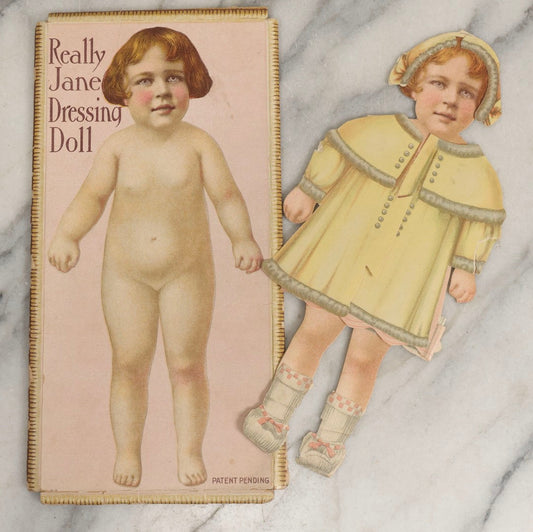 Lot 056 - Antique “Really Jane Dressing Doll” Paper Doll Toy In Original Box Folder With Clothes, Period Clippings, And Note From “Fairy God Mother,” Patent Pending
