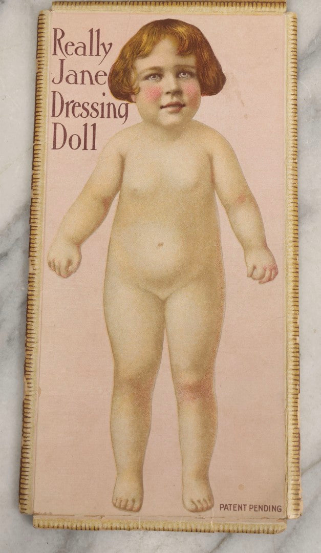 Lot 056 - Antique “Really Jane Dressing Doll” Paper Doll Toy In Original Box Folder With Clothes, Period Clippings, And Note From “Fairy God Mother,” Patent Pending