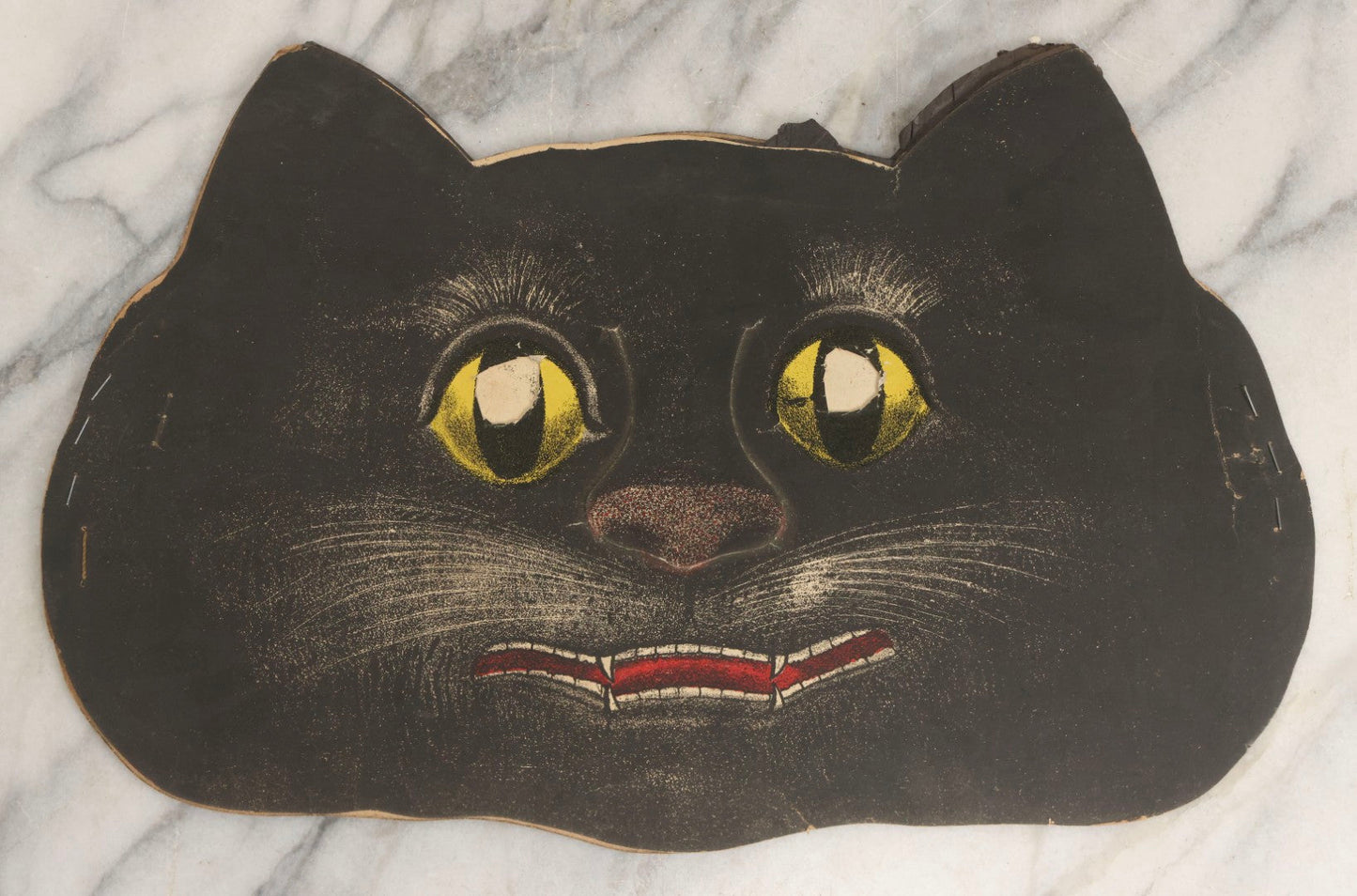Lot 058 - Vintage Halloween Paper Cutout Mask Of Sad Black Cat With Yellow Eyes And Red Mouth, Made In Germany, Unknown Manufacturer, 14" x 9"