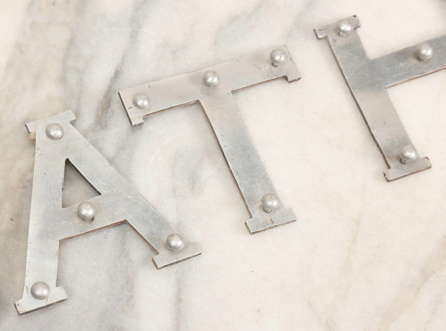 Lot 059 - Vintage Die-Cut Aluminum Sheet Metal Letters Spelling “D-E-A-T-H” With Original Rivets