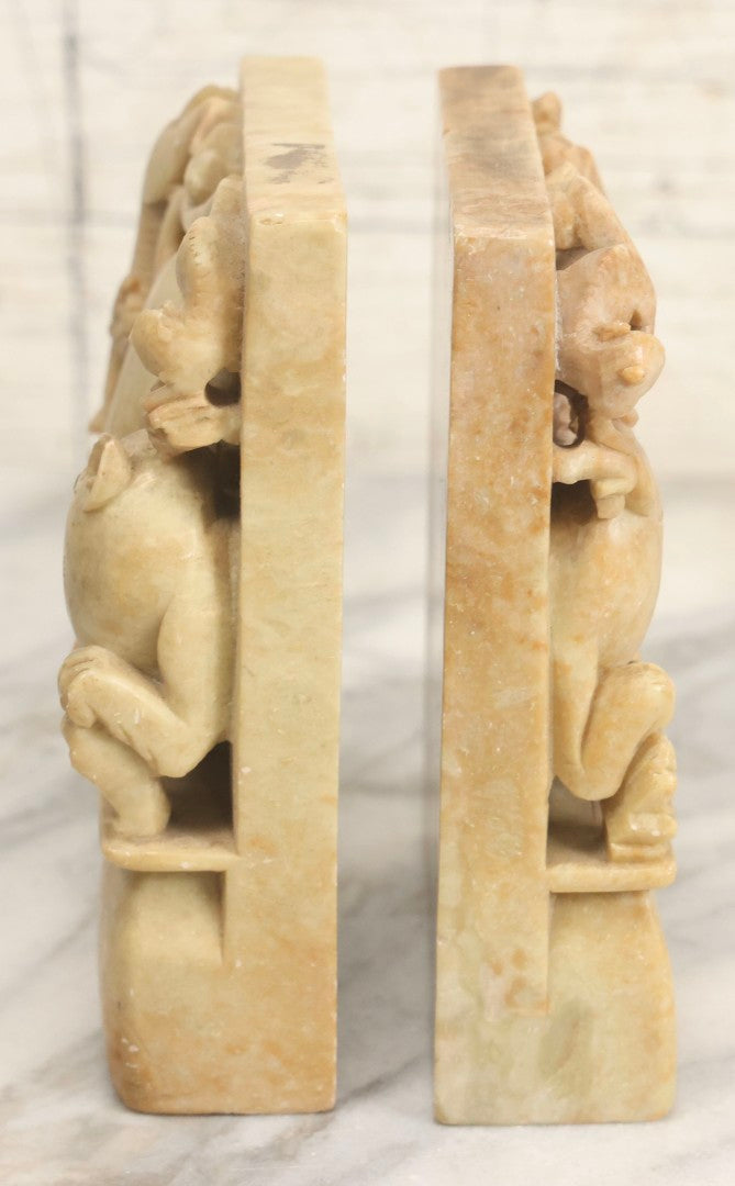 Lot 060 - Pair Of Vintage Chinese Carved Stone Bookends With Monkey And Beast In High-Relief Jungle Scene