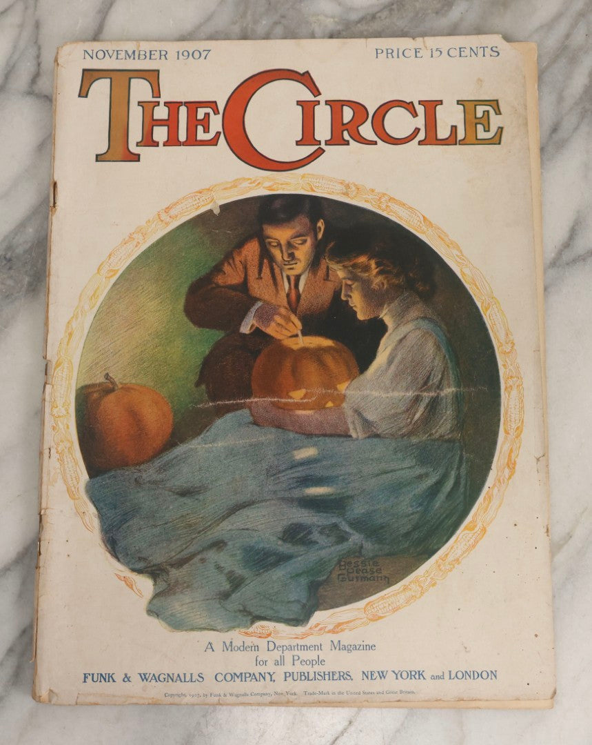 Lot 066 - Antique “The Circle” Magazine, November 1907, With Cover Of Man And Woman Carving Halloween Jack-O-Lantern Illustrated By Bessie Pease Gutmann, Copyright Funk & Wagnalls Co., New York
