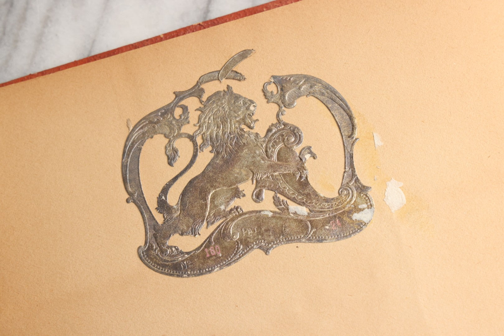 Lot 077 - Antique Red Scrapbook Album With Cat And Birdcage Illustration On Cover, 40+ Pasted Scraps, Victorian Trade Cards, Die Cuts, Loose Ephemera, Rena B. Coggeshalt Name Card, Circa 1875