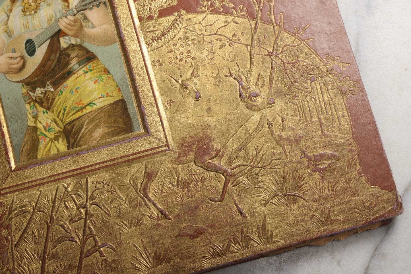 Lot 078 - Antique Scrapbook Album With Gold Embossed Deer In Forest And Pasted Gypsy Woman Chromolithograph On Cover, 150+ Victorian Trade Cards, Die Cuts, Children, Pets And Women's Fashion, Circa 1898