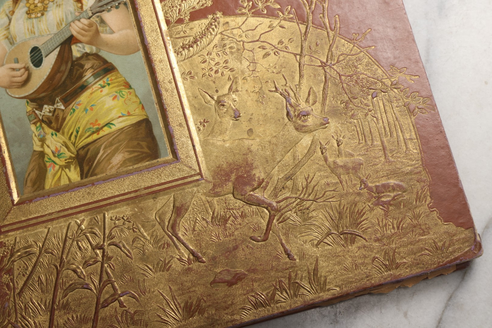 Lot 078 - Antique Scrapbook Album With Gold Embossed Deer In Forest And Pasted Gypsy Woman Chromolithograph On Cover, 150+ Victorian Trade Cards, Die Cuts, Children, Pets And Women's Fashion, Circa 1898