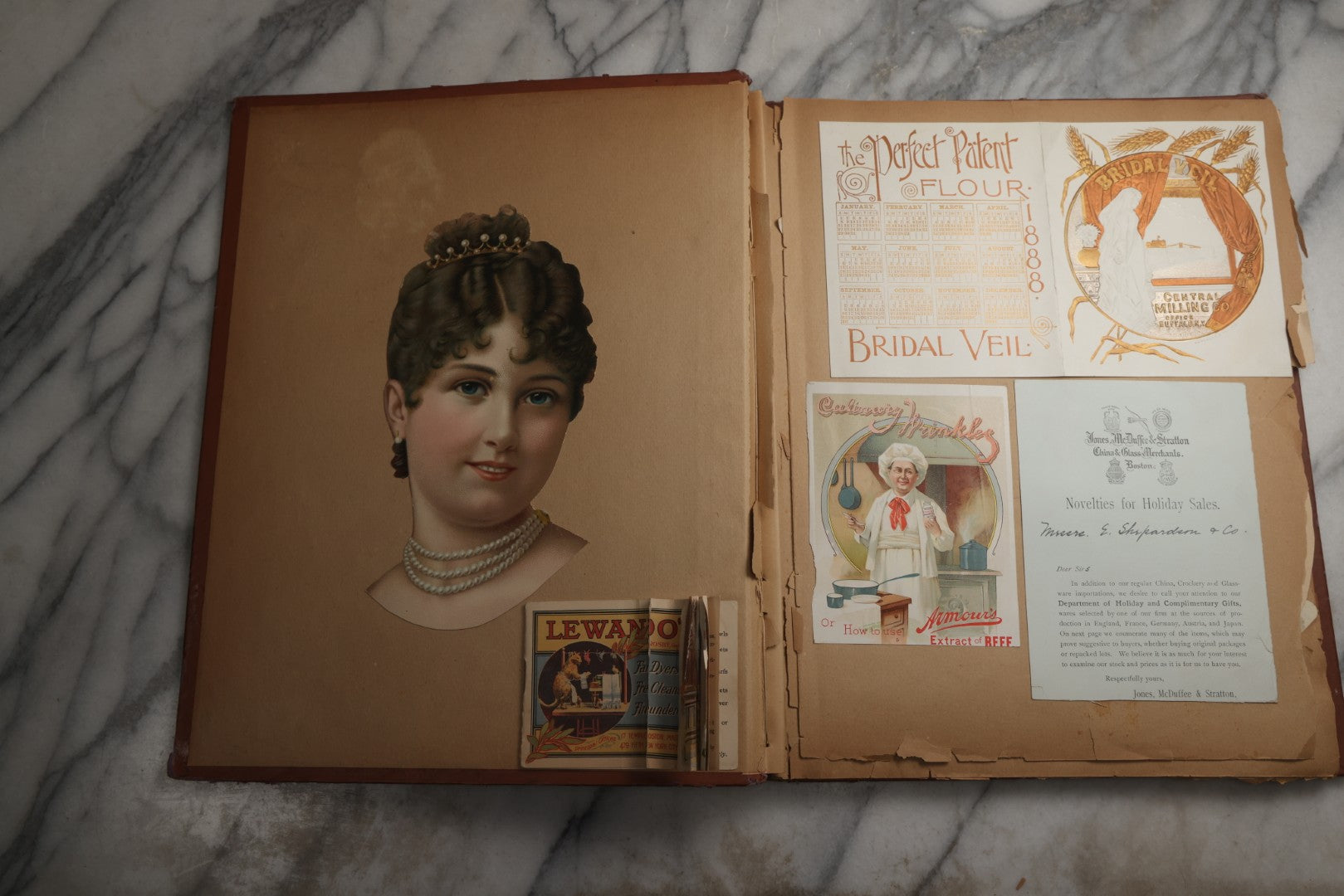 Lot 078 - Antique Scrapbook Album With Gold Embossed Deer In Forest And Pasted Gypsy Woman Chromolithograph On Cover, 150+ Victorian Trade Cards, Die Cuts, Children, Pets And Women's Fashion, Circa 1898