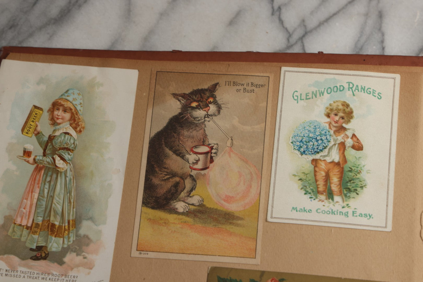 Lot 078 - Antique Scrapbook Album With Gold Embossed Deer In Forest And Pasted Gypsy Woman Chromolithograph On Cover, 150+ Victorian Trade Cards, Die Cuts, Children, Pets And Women's Fashion, Circa 1898