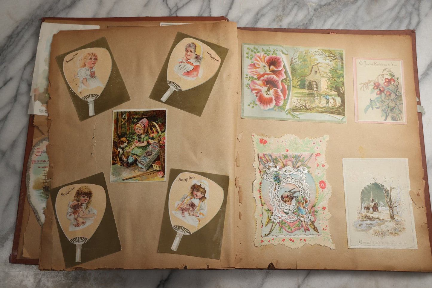 Lot 078 - Antique Scrapbook Album With Gold Embossed Deer In Forest And Pasted Gypsy Woman Chromolithograph On Cover, 150+ Victorian Trade Cards, Die Cuts, Children, Pets And Women's Fashion, Circa 1898