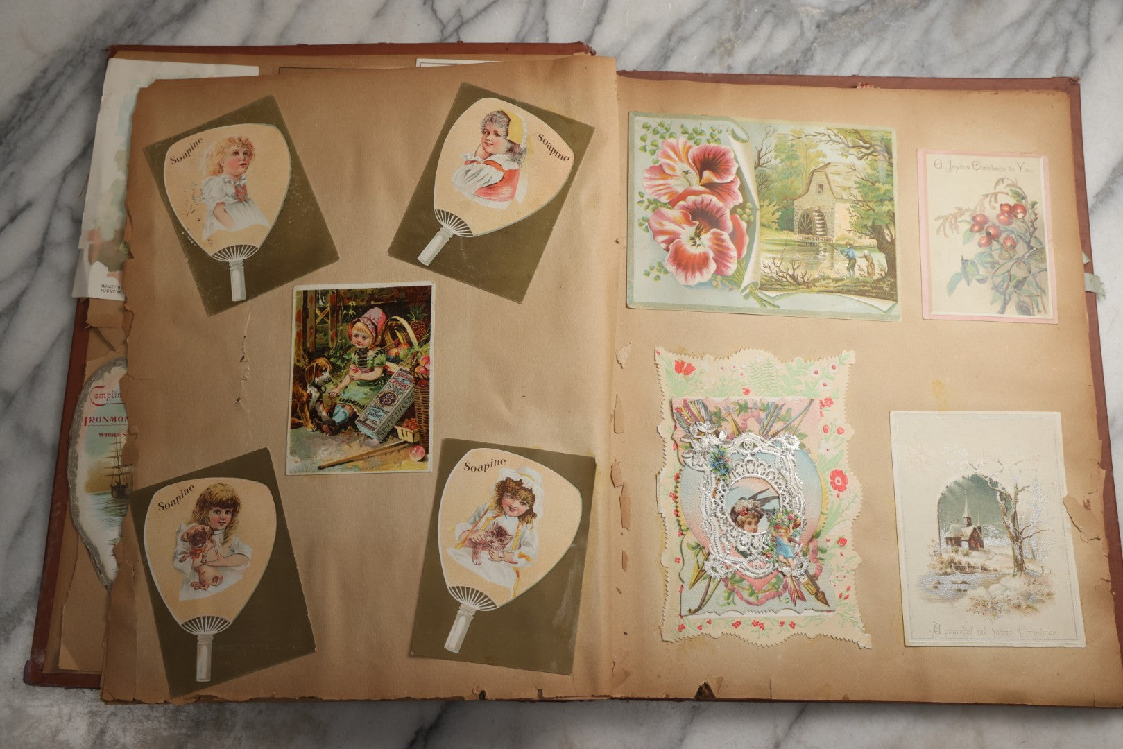 Lot 078 - Antique Scrapbook Album With Gold Embossed Deer In Forest And Pasted Gypsy Woman Chromolithograph On Cover, 150+ Victorian Trade Cards, Die Cuts, Children, Pets And Women's Fashion, Circa 1898
