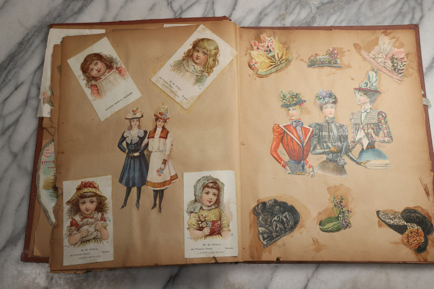 Lot 078 - Antique Scrapbook Album With Gold Embossed Deer In Forest And Pasted Gypsy Woman Chromolithograph On Cover, 150+ Victorian Trade Cards, Die Cuts, Children, Pets And Women's Fashion, Circa 1898