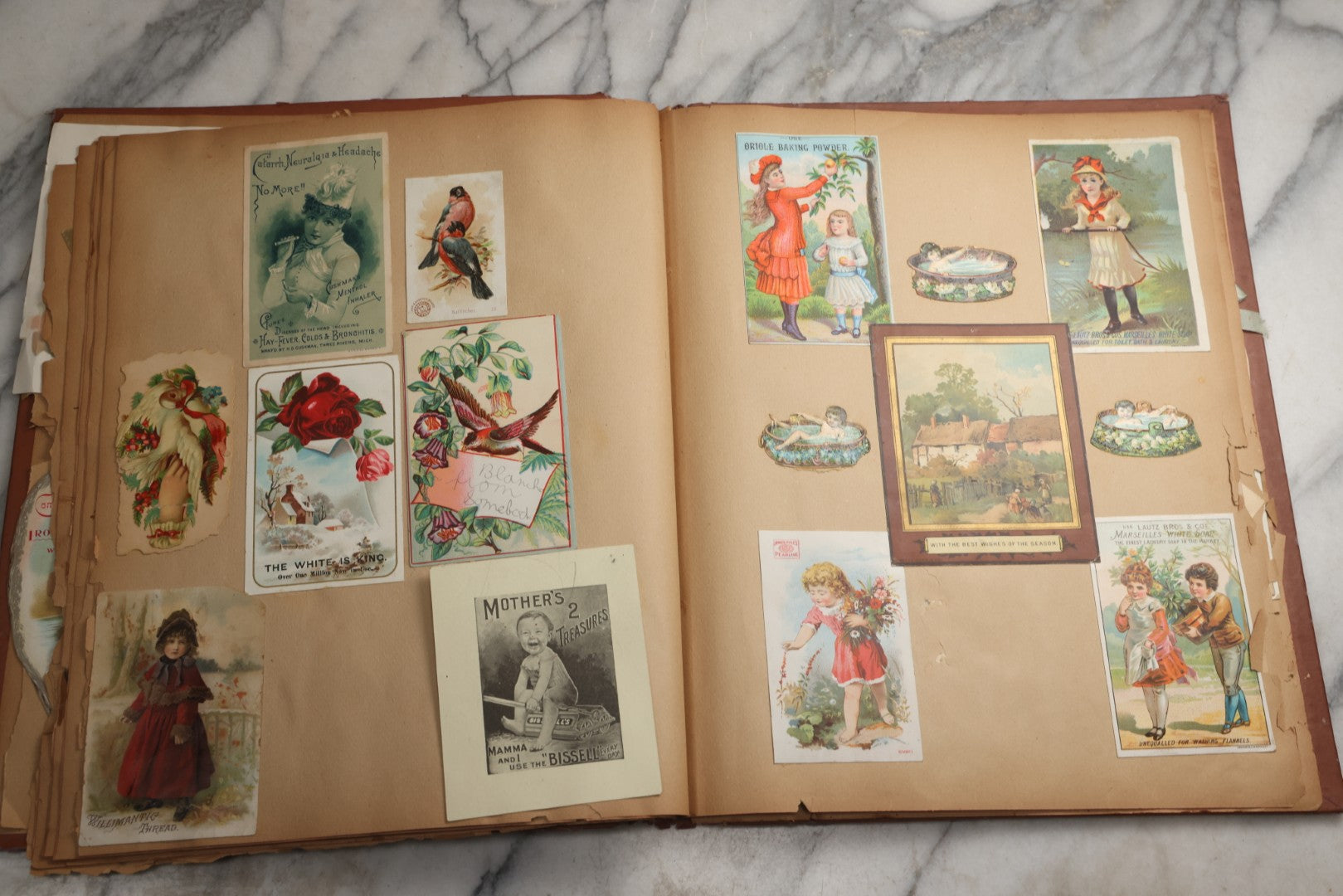 Lot 078 - Antique Scrapbook Album With Gold Embossed Deer In Forest And Pasted Gypsy Woman Chromolithograph On Cover, 150+ Victorian Trade Cards, Die Cuts, Children, Pets And Women's Fashion, Circa 1898