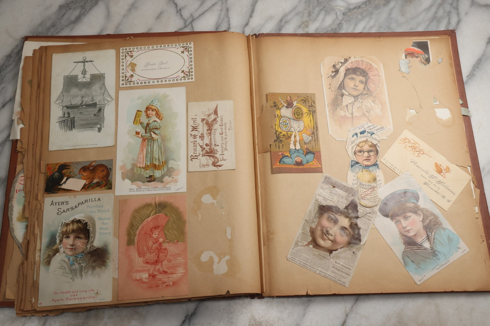 Lot 078 - Antique Scrapbook Album With Gold Embossed Deer In Forest And Pasted Gypsy Woman Chromolithograph On Cover, 150+ Victorian Trade Cards, Die Cuts, Children, Pets And Women's Fashion, Circa 1898
