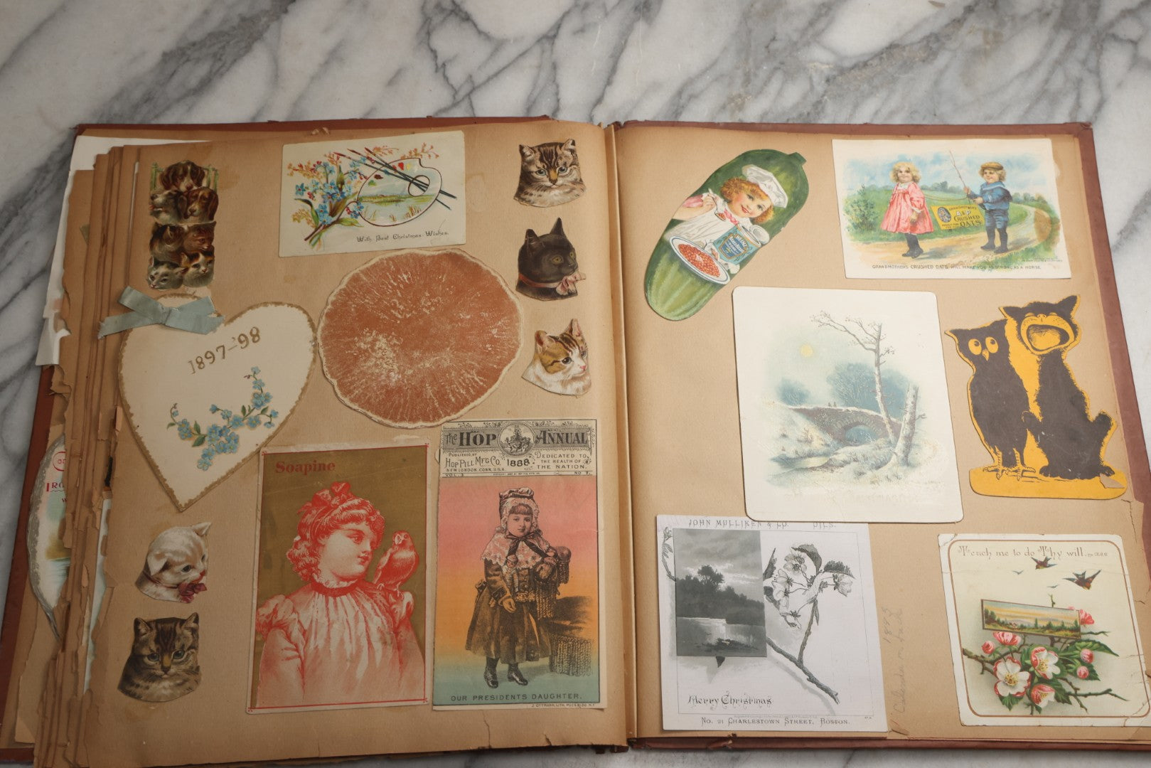 Lot 078 - Antique Scrapbook Album With Gold Embossed Deer In Forest And Pasted Gypsy Woman Chromolithograph On Cover, 150+ Victorian Trade Cards, Die Cuts, Children, Pets And Women's Fashion, Circa 1898