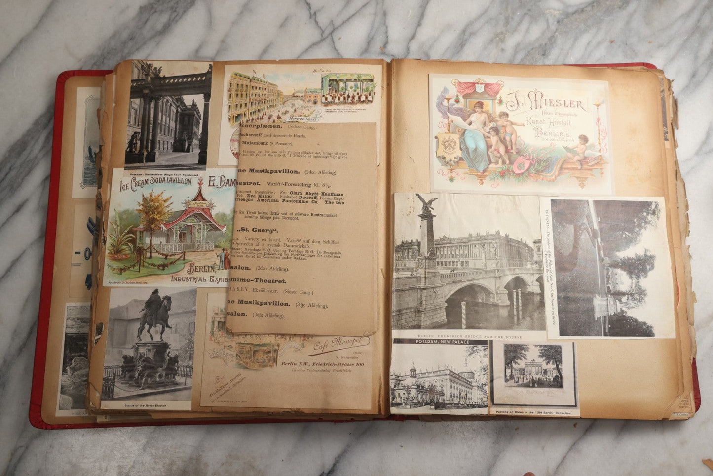 Lot 079 - Antique Red Scrapbook Album With Silver Painted Embossed Decorations, Hamburg, Stockholm, Paris, England, Stratford-On-Avon, Scotland, Liverpool Ephemera, Two Full Spreads Homemade Herbarium, Circa 1896